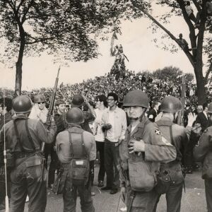 Protestors swarm over a statue of Civil War Gen. John Logan on Aug. 26, 1968, in Grant Park. | Sun-Times files