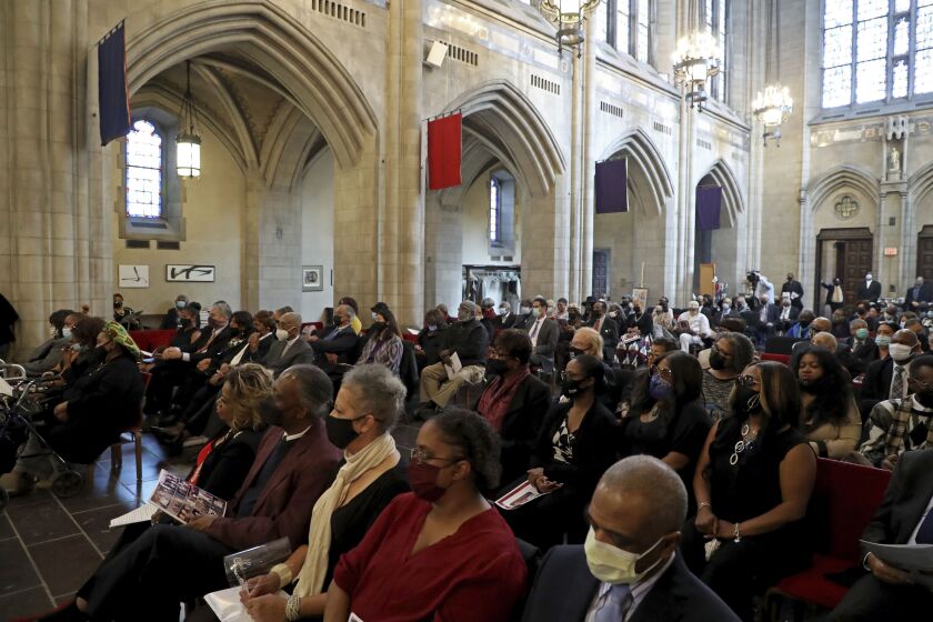 Mourners attend funeral services for civil rights leader and political activist Timuel Black at First Unitarian Church of Chicago on Friday, Oct. 22, 2021. (Terrence Antonio James/Chicago Tribune via AP, Pool) ORG XMIT: ILCHT401
