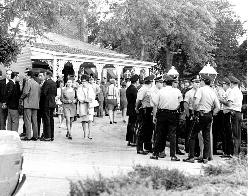 Mourners line the drive outside a North Side funeral home in 1970 for visitation the day before the funeral mass for slain Chicago Police Officer Anthony Rizzato.