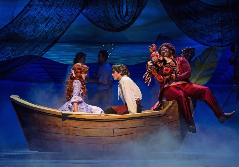 Kari Yancy (from left) plays Ariel, with Devin DeSantis as Prince Eric and Jonathan Butler-Duplessis as Sebastian the crab in Paramount Theatre’s production of “The Little Mermaid.” (Photo: Liz Lauren)