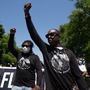 Protesters march down South Independence Boulevard in North Lawndale during the West Side interfaith peace march to demand police reform and equal opportunities for Black Americans on June 12, 2020. Protesters stopped at sites that Dr. Martin Luther King Jr. visited.