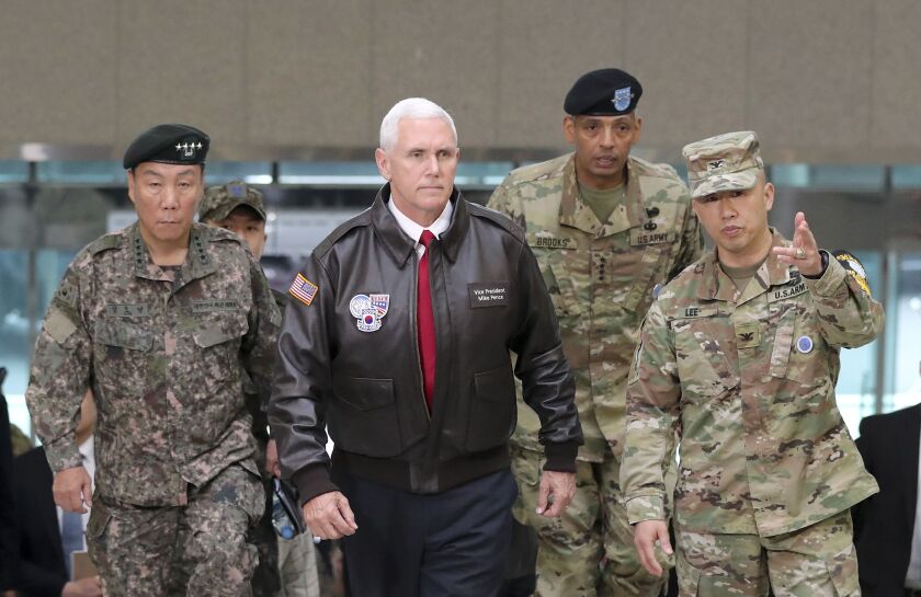 U.S. Vice President Mike Pence (center) arrives with U.S. Gen. Vincent Brooks (second from right), commander of the United Nations Command, U.S. Forces Korea and Combined Forces Command, and Gen. Leem Ho-young (left), South Korean Deputy Commander of the