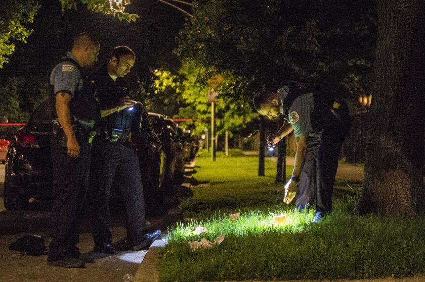 Chicago police investigate two people who were shot Tuesday morning in the 1000 block of North Spaulding. | Tyler Lariviere/Sun-Times