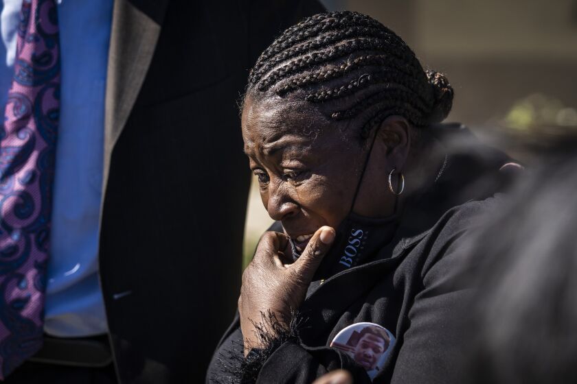Flanked by family, attorneys and supporters, Beatrice Roberson cries after a news conference Friday at a West Side church discussing the announcement that Cook County State’s Attorney Kim Foxx’s office would not be filing charges in connection with the fatal shooting of her son, Jemel Roberson.