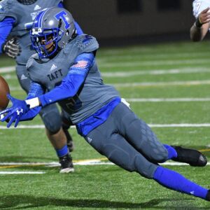 Taft’s Jermaine Johnson (3) fumbles the ball against Solorio. Worsom Robinson/For the Sun-Times.