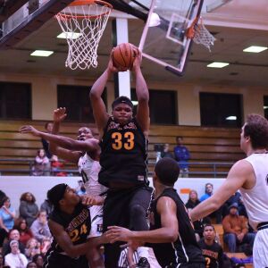 St. Mel’s Taeyon Neal (33) pulls in a rebound. Worsom Robinson/For the Sun-Times.