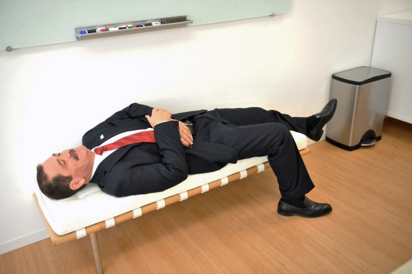 <small><strong>While waiting for all the mayoral candidates to arrive, Jesus “Chuy” Garcia joked around by laying down on a chair in the Chicago Sun-Times offices. | Al Podgorski/Sun-Times Media</strong></small>