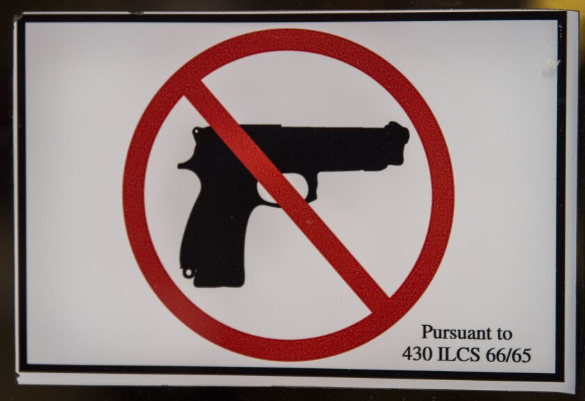 Gun-free zone sign on the door to City Hall in 2015.