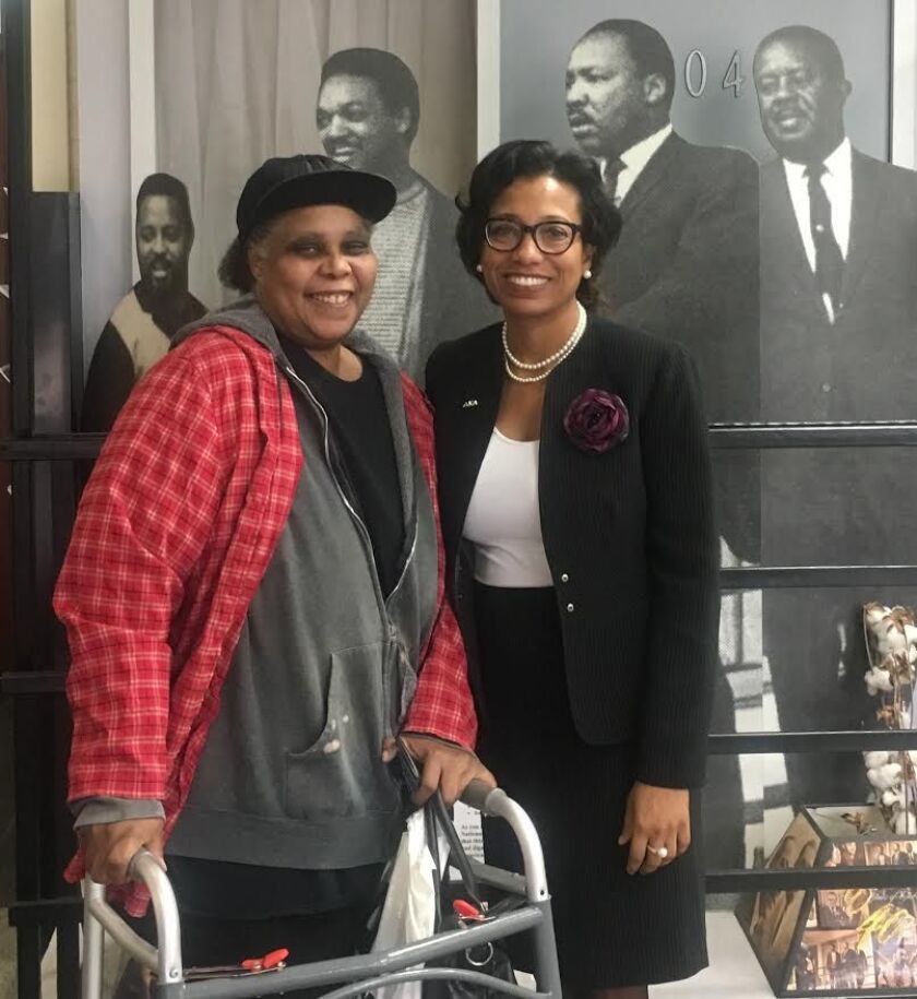 Tanya Woods (right), executive director of the Westside Justice Center in East Garfield Park, with Englewood homeowner Sharon Davis at Rainbow PUSH. Davis sought help paying property taxes on a home she’s lived in for 43 years. She said she was injured on