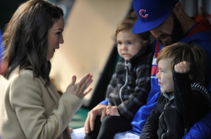 <em>Arrieta with his family before a game last year</em>