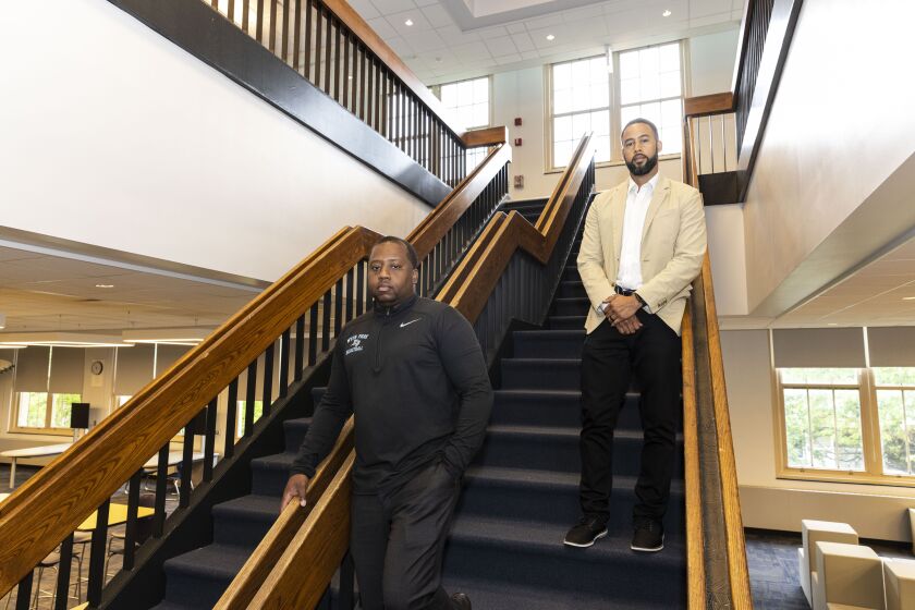 Principal Antonio Ross (left) and Dean La Troy Farrow in the library of Hyde Park Academy High School, 6220 S Stony Island Ave. in Hyde Park.