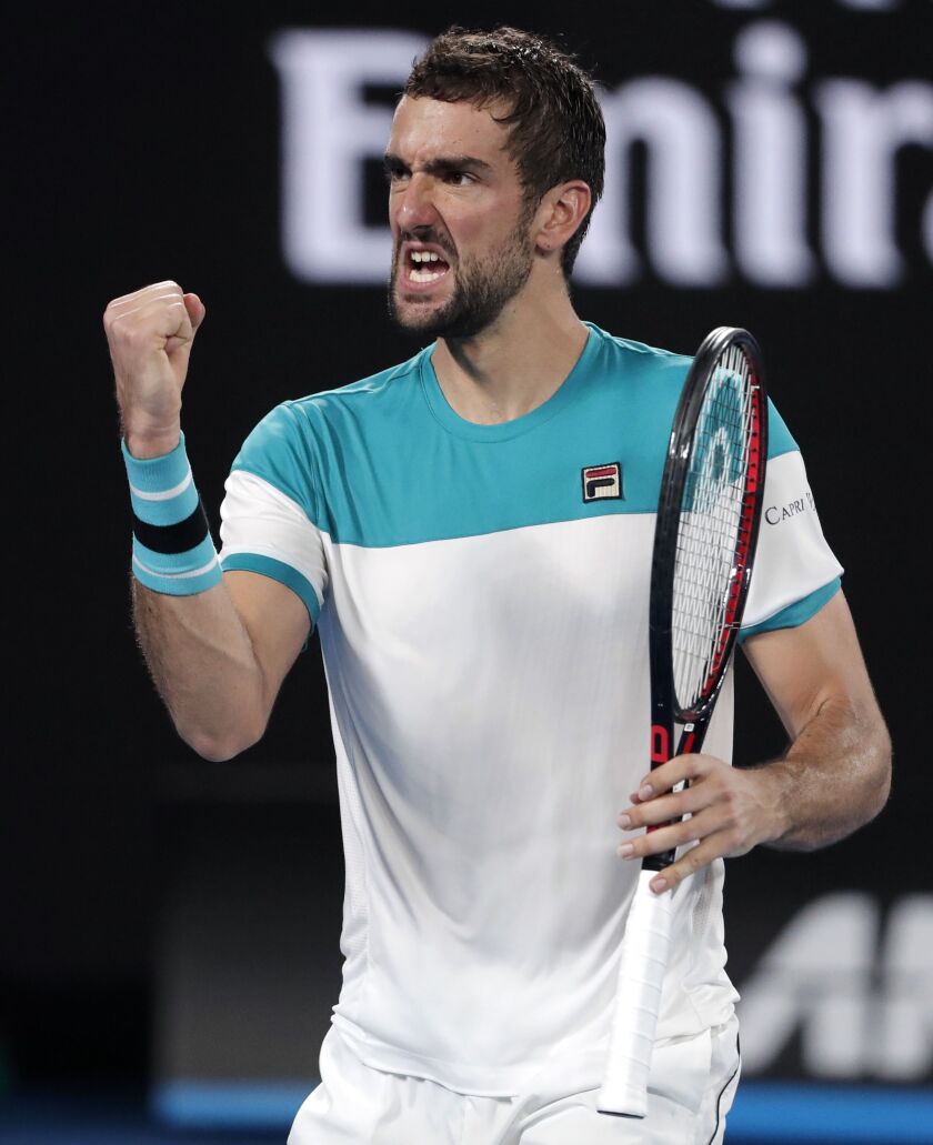 Croatia’s Marin Cilic reacts after winning a point against Switzerland’s Roger Federer during the men’s singles final at the Australian Open tennis championships in Melbourne, Australia, on Sunday. | AP photo