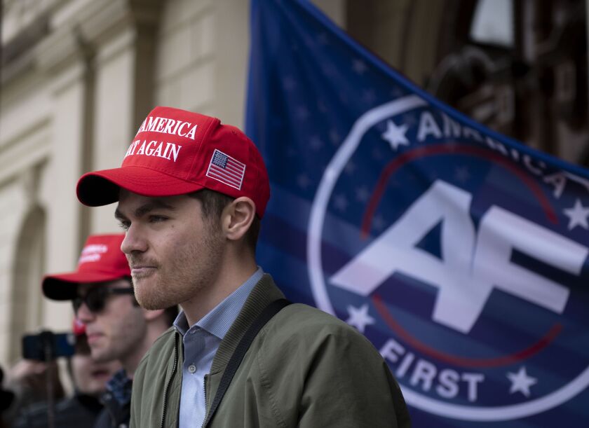 Far right activist Nick Fuentes holding a rally last November at the Michigan State Capitol in Lansing, Mich. Fuentes got a donation of about $250,000 from a French computer programmer in late 2020 and spent the coming weeks encouraging his tens of thousands of followers to lay siege to the U.S. Capitol. The money slipped quietly into the United States, not triggering alerts it might have had it landed via traditional banking channels.
