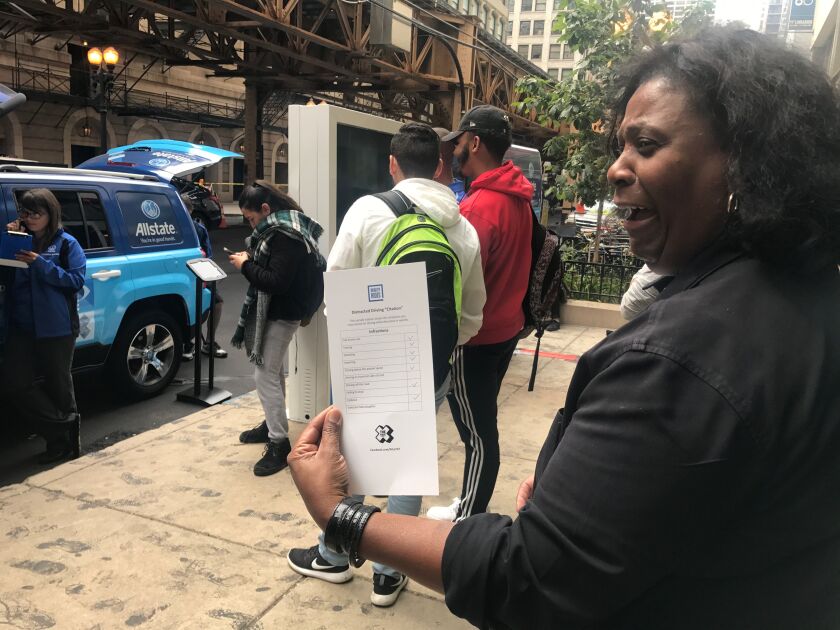 Hilda Thompson, an Allstate agent in the South Loop, looks over the infractions she committed while using the driving simulator. | Taylor Hartz/For the Sun-Times