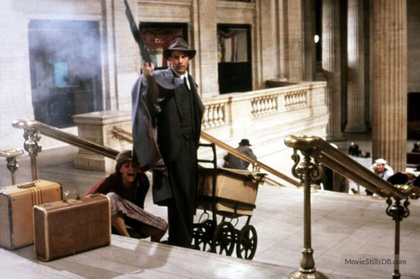 Melody Rae (on stairs) had a memorable scene in “The Untouchables,” starring Kevin Costner. | Photo from MovieStillsDB.com/copyright Paramount Pictures