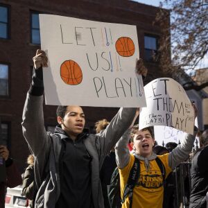 Students staged a protest Monday asking that the boys basketball team be allowed to play.