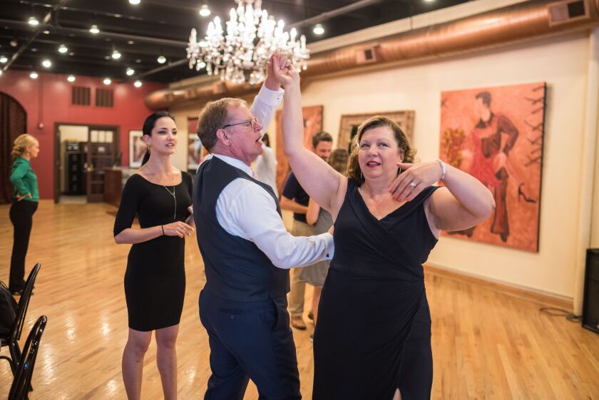 Jacqueline Toepfer and Kurt Bullard dance at Arthur Murray studio in River North as their teacher, Basia Kaczmarek (left) gives them some guidance on July 18, 2017. | Max Herman/For the Sun-Times