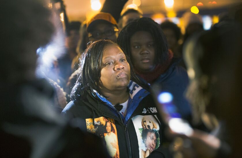 Dorothy Holmes, the mother of Ronald Johnson, joins demonstrators in December 2015 protesting the shooting death of her son, on the day it was announced that no criminal charges would be filed against the officer who fired the fatal shots. | Scott Olson/