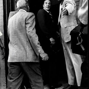 Criminal Court Judge Philip Romiti looks back before entering apartment at 2337 W. Monroe where Fred Hampton and Mark Clark were shot to death in Dec. 4, 1969.