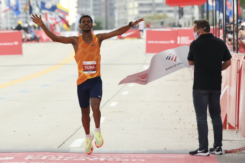 Seifu Tura Abdiwak, of Ethiopia, wins the men’s Chicago Marathon, Sunday, Oct. 10, 2021, in Chicago.