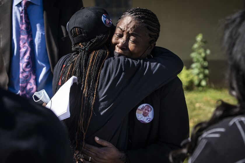 Beatrice Roberson cries and hugs a supporter after a news conference Friday at a West Side church discussing the announcement that Cook County State’s Attorney Kim Foxx’s office would not be filing charges in connection with the fatal shooting of her son, Jemel Roberson.