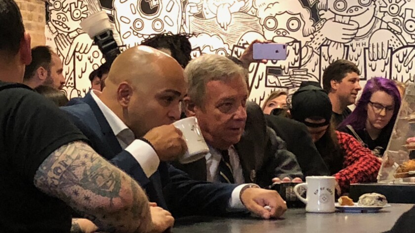 Sen. Dick Durbin and Cook County Commissioner Luis Arroyo Jr. have a cup of coffee at the newly opened Sip of Hope in Logan Square. | Alexandra Arriaga/Sun-Times
