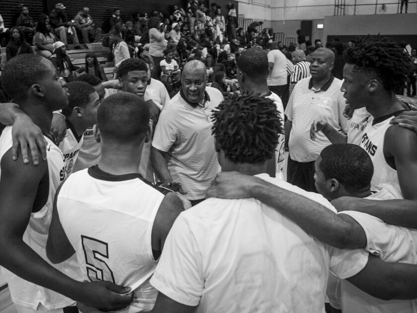 Players on the Orr Academy High School basketball team get fired up during a timeout against North Lawndale College Prep High School, Jan. 13, 2017.