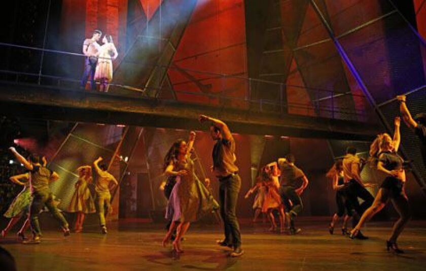 Zoe Nadal plays Maria and Will Skrip plays Tony (on the bridge) in the Paramount Theatre production of “West Side Story.” (Photo: Liz Lauren).