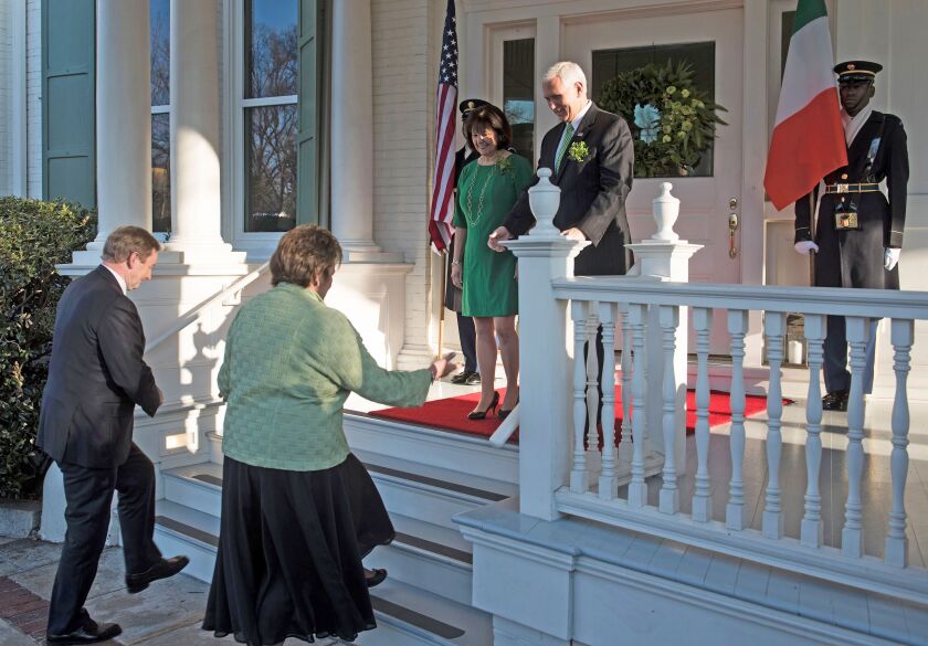 Vice President Mike Pence (right) and wife Karen Pence greet Taoiseach Enda Kenny of Ireland (left) and his wife Fionnuala Kenny at the Naval Observatory. | Brendan Smialowski/AFP/Getty Images