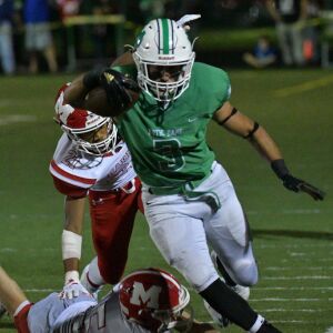 Frank Giamarusti (3) of Notre Dame steps over a Marist defender. Worsom Robinson/For the Sun-Times.