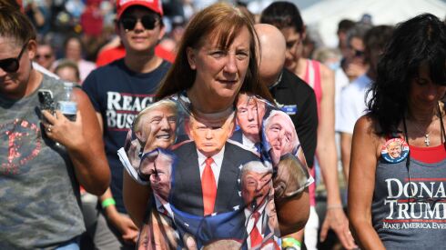 Supporters of Donald Trump pray at a Save America Rally at the Adams County Fairgrounds in Mendon, Illinois on June 25, 2022.