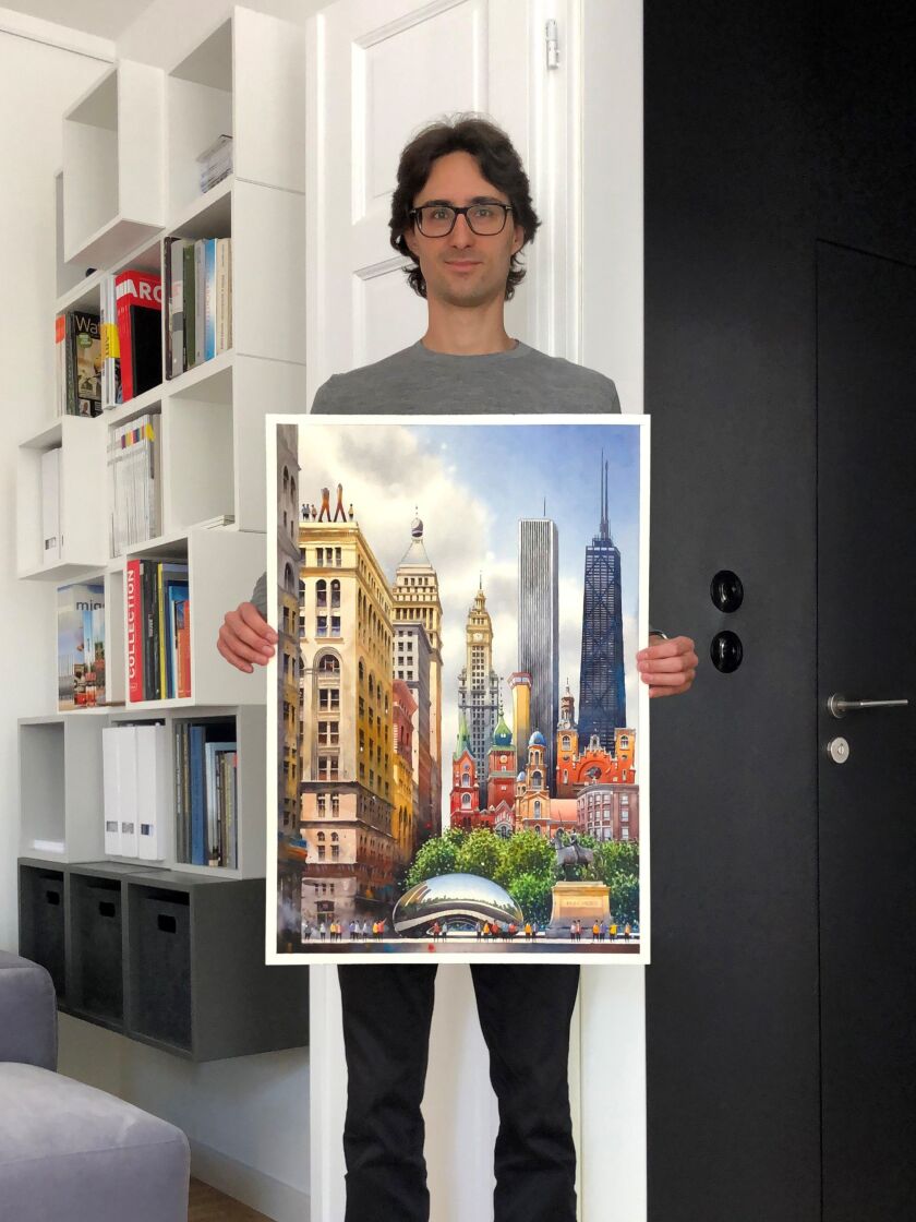 “Tytus Brzozowski displays his watercolor of Chicago from the exhibit “Tytus Brzozowski: 12 Cities.”