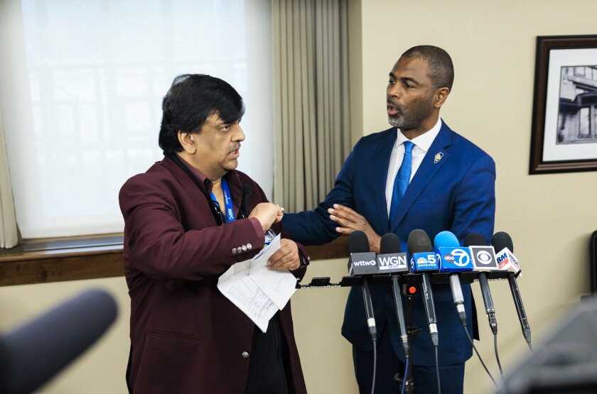 State Rep. La Shawn K. Ford (right) speaks with Resilience Healthcare CEO Manoj Prasad during a news conference Wednesday to explain the financial situation at West Suburban Medical Center in Oak Park and discuss the hospital's temporary closure and plans to try to reopen it.