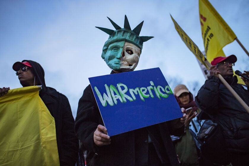 Protesters gather in New York for a rally against the U.S. missile strikes in Syria. | Andres Kudacki/Associated Press