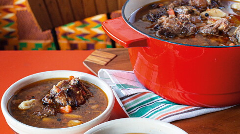 This image released by Voracious shows a recipe for oxtail pepperpot with dumplings, from the cookbook "The Rise" by Marcus Samuelsson.