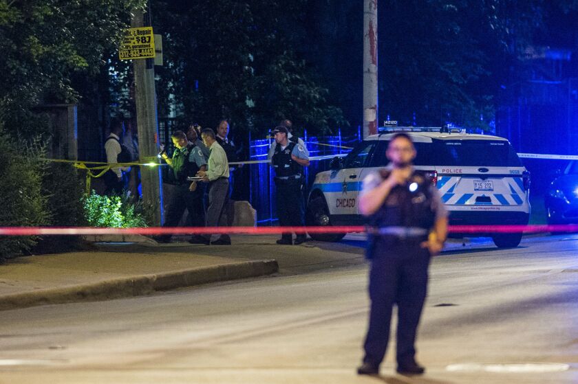 Police investigate an officer-involved shooting Monday night in the 2300 block of East 79th Street. | Tyler LaRiviere / Sun-Times