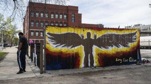 Memorial for 13-year-old Adam Toledo painted on the fence next to the spot where he was fatally shot by a Chicago police officer on March 29, 2021.
