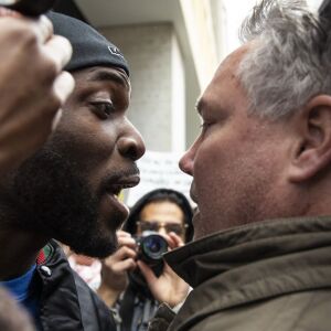Community activist Jedidiah Brown spars with Fraternal Order of Police members and supporters. | Ashlee Rezin/Sun-Times