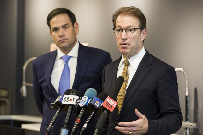 U.S. Rep. Peter Roskam (right) speaks to reporters after being endorsed by U.S. Sen. Marco Rubio during a press conference at Elkay Manufacturing in Oak Brook on Monday. | Ashlee Rezin/Sun-Times
