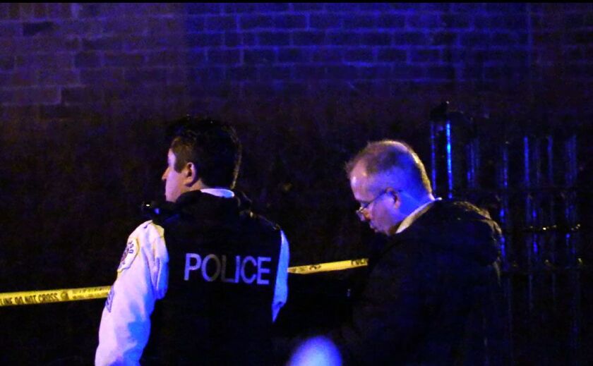 Officers respond to a fatal shooting Friday night in the Hyde Park neighborhood. | Justin Jackosn/Sun-Times