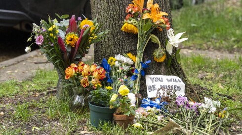 Flowers left at a memorial for Nick Calzaretta near where he was shot and killed last week in Edgewater, Monday, May 18, 2026.