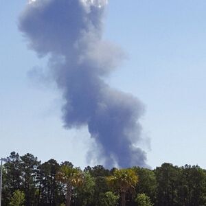 Smoke rises from a deadly military plane crash Wednesday. | Minh Phan via AP